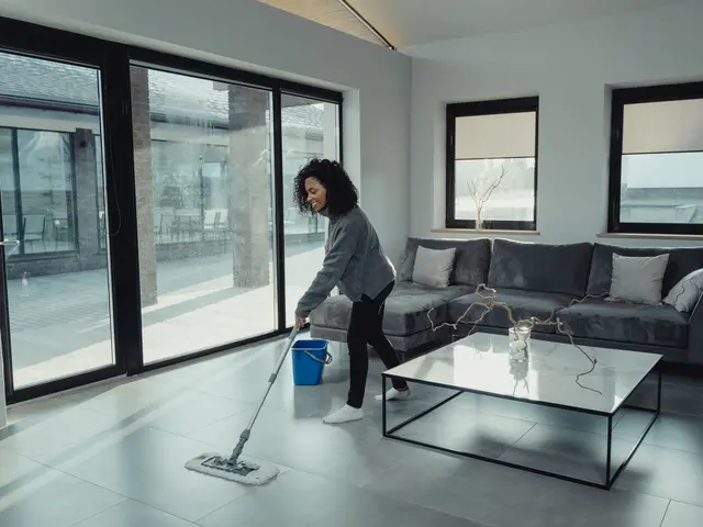 A person mopping a living room floor